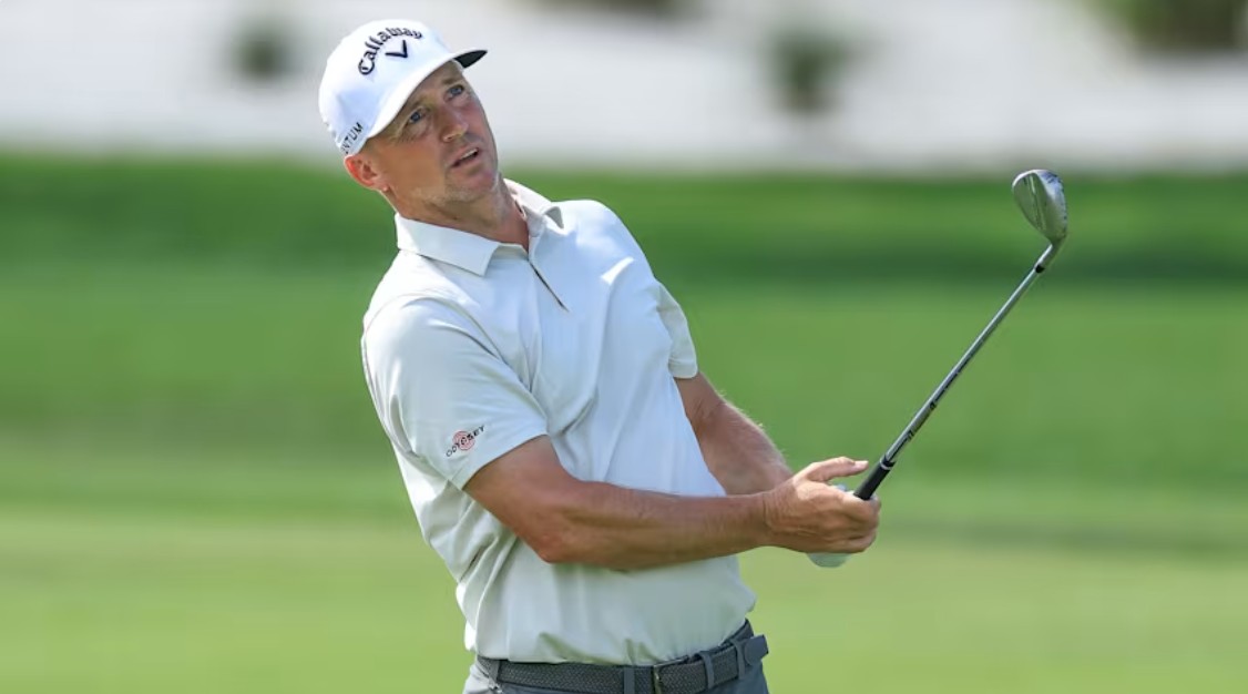 Alex Noren following through on his golf swing